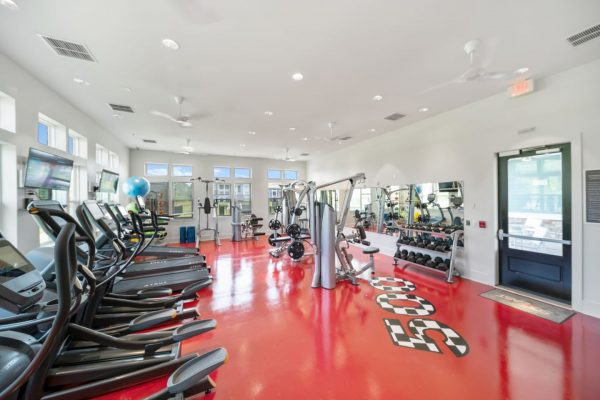 State-of-the-art fitness center with numerous cardio and strengthening equipment options, including treadmills, ellipticals, free weights, and two full-body work machines